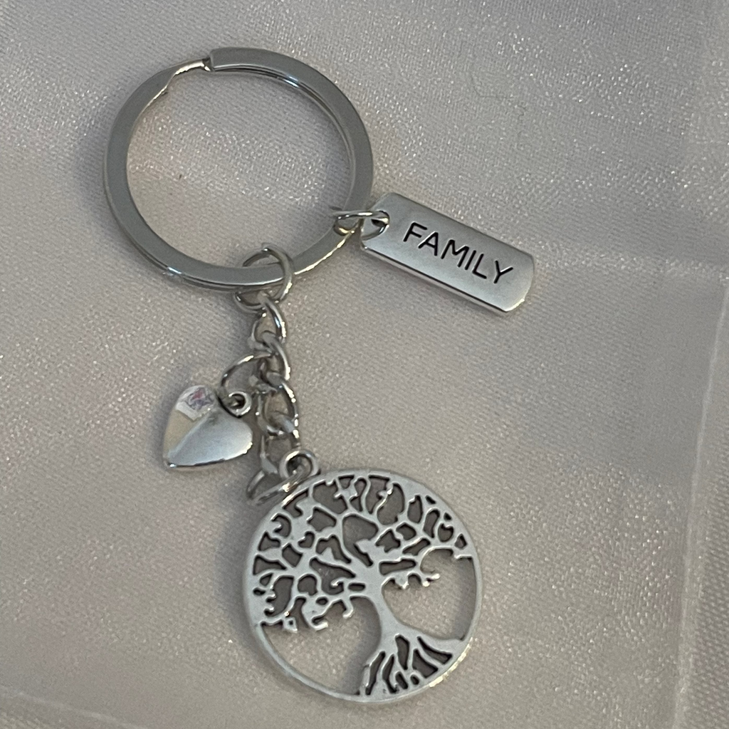 Silver keychain with tree of life design and 'FAMILY' tag